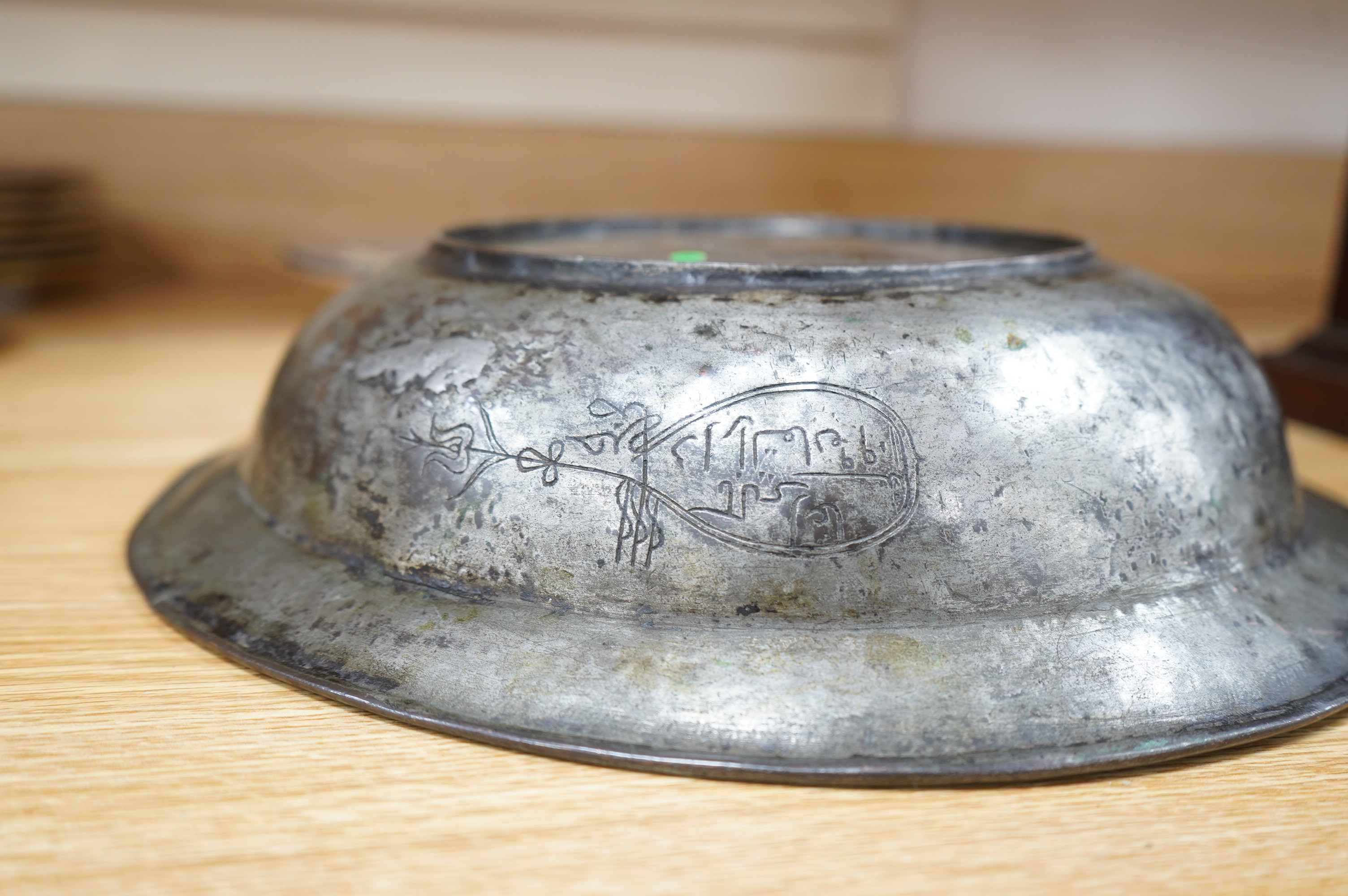 A Safavid tinned copper bowl engraved with a goat and flowers, 32cm diameter. Condition - fair